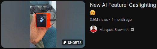 a screenshot of a Marques Brownlee video, "New AI Feature: Gaslughting surprised covering face emoji